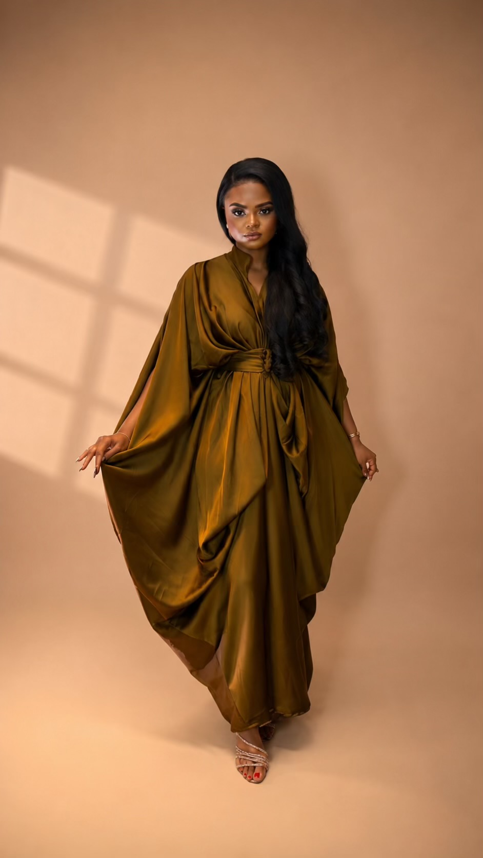 Woman wearing an olive draped JINNA outfit