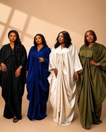 Four women in satin bubus in black, cobalt, ivory and olive