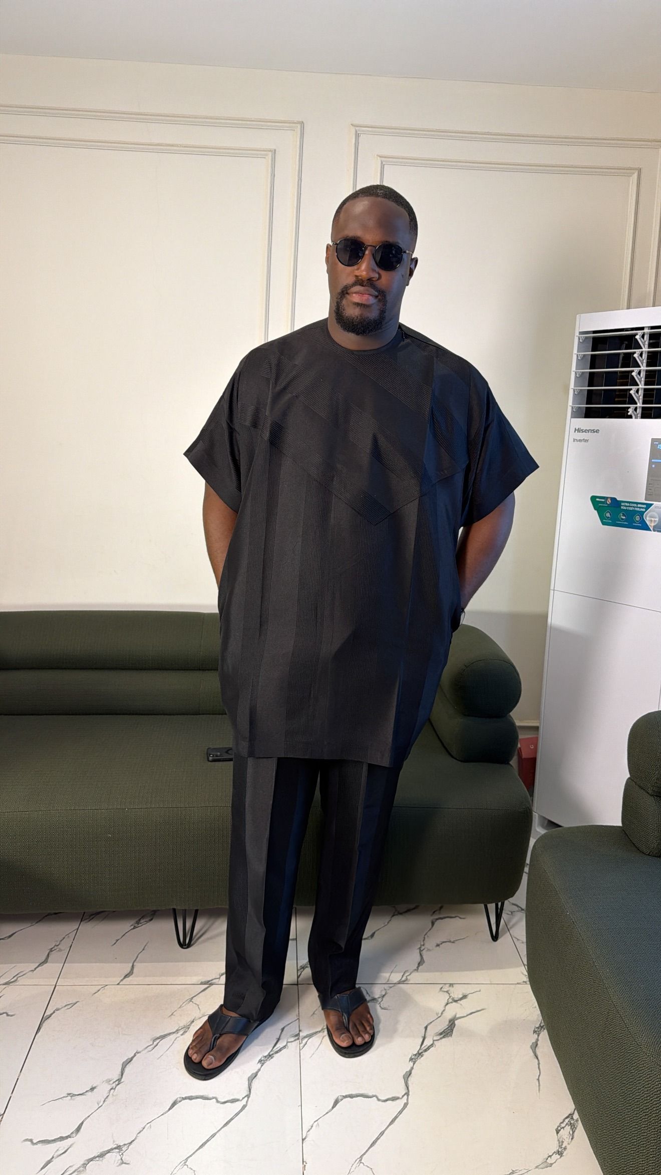 Man in a black tonal jacquard two-piece, front view